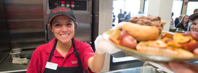 student worker serving food