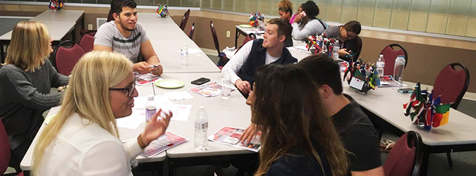 students sitting around a table talking